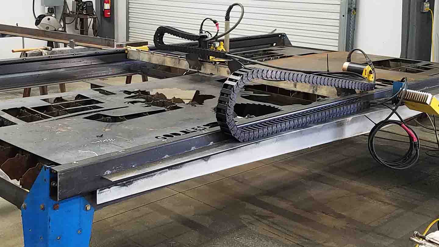 Wide angle of a CNC plasma table, without torch running.